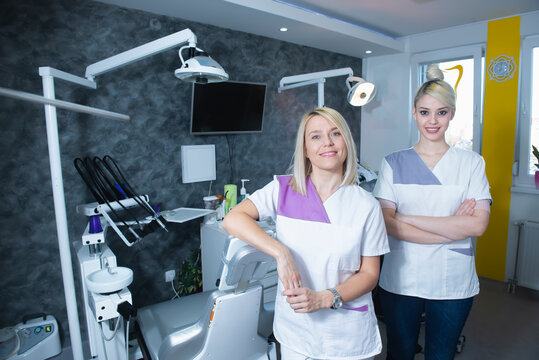 Team of two female dentists in their clinic - Powered by Adobe
