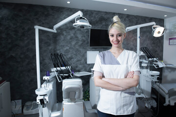 Young female dentist in her office