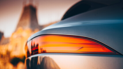 Rear LED red back light of a luxury SUV car, close up detail. Automotive industry.
