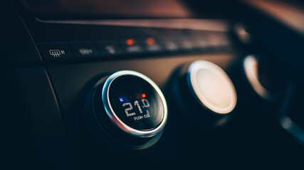 Climatronic car setup. Touch buttons to control the climate temperature and AC inside a luxury car.