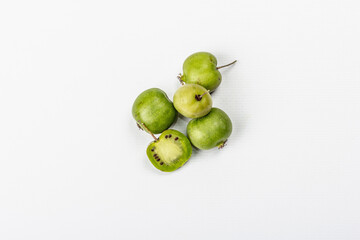 Ripe Actinidia arguta or kiwi isolated on white background
