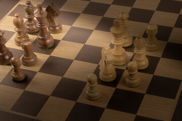 Chess board with figures, the concept of business strategy or intellectual games.