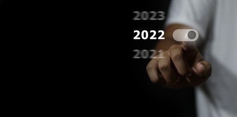 business target and goal on New year 2022 concept, hand holding 2022 virtual screen. new years business. new ideas coming up in the future.