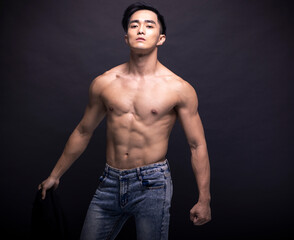 Fototapeta premium Asian young man with fitness body