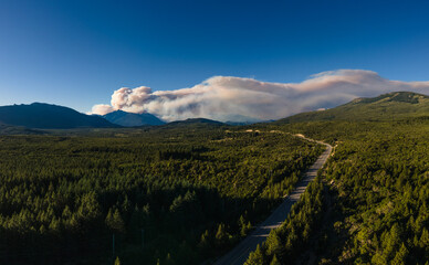 smoke from fires over the mountains at sunset.