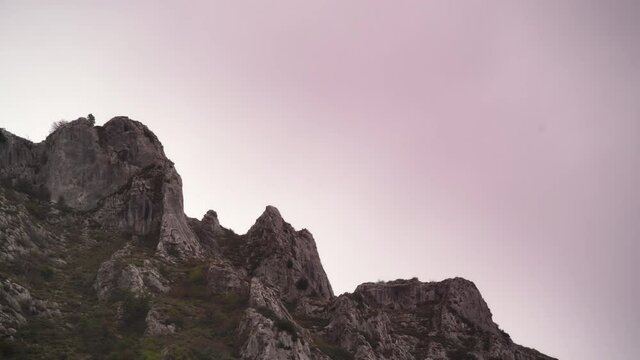 Time lapse of clouds moving over rocky mountains, Agurain, Basque Country, Spain. Cloudy weather.