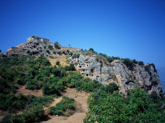 houses and temples carved in the rocks in Kayakoy, Turkey