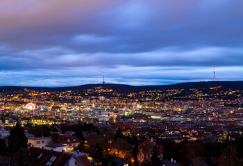 Stuttgart Cauldron nighttime panorama. Illuminated town at winter evening blue hour with hundreds of lights. Capital and largest city of the German state of Baden-Württemberg.  Cradle of automobile.