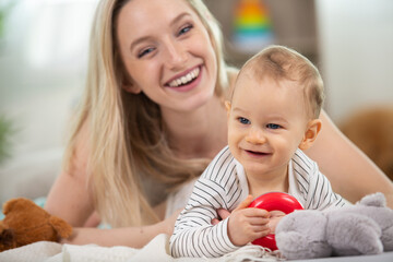 happy baby girl enjoying time with her mum