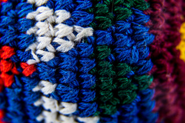 Knit macro shot showing the knots in different colors