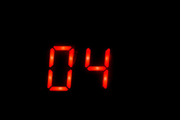 Old digital clock red number on black background
