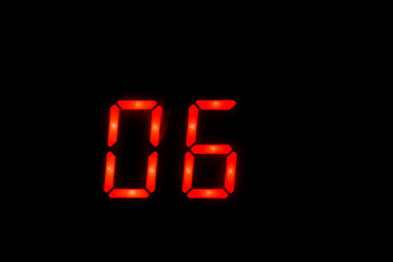 Old digital clock red number on black background