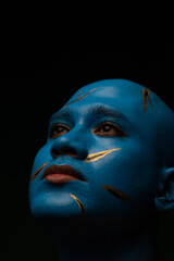 Bald man in blue makeup