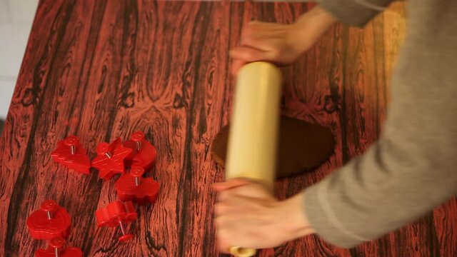 Making cookies. Molding cookie dough. Female hands making cookies on table in kitchen (Soviet Union old flat)