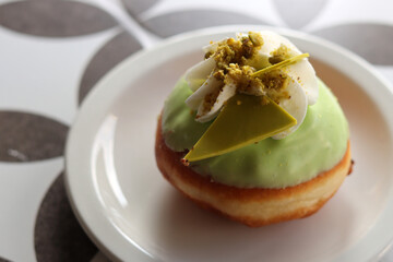 Pistachio doughnut close up photo. Symbol of Jewish Hanukkah festival. 