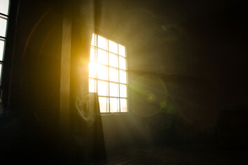 Sunshine window reflection on the wooden floor. Heavy smoke in loft design studio. Cinematic photo.
