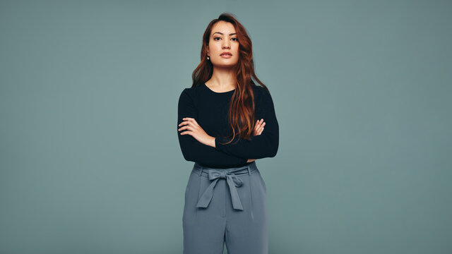 Independent young woman standing in a studio