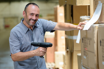 warehouse worker scanning barcode with handheld device