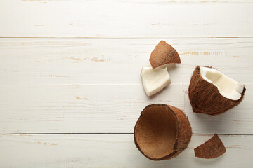 Fresh coconut on white wooden background. Healthy cooking.