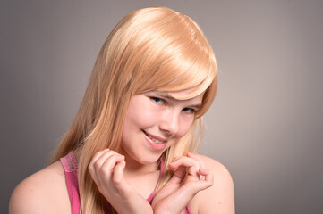 Portrait of blonde girl posing in studio
