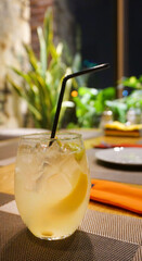 cocktail with lemon on the table in the cafe in the bar refreshing drink