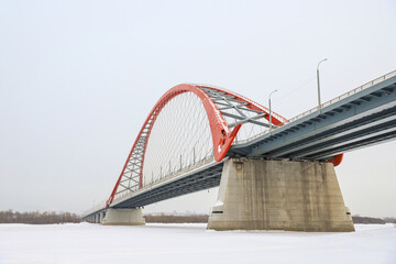 The large red arch bridge in winter close-up