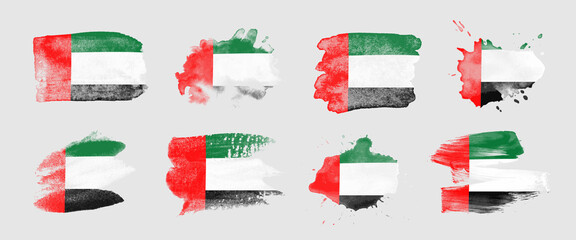 Painted flag of the United Arab Emirates in various brushstroke styles.