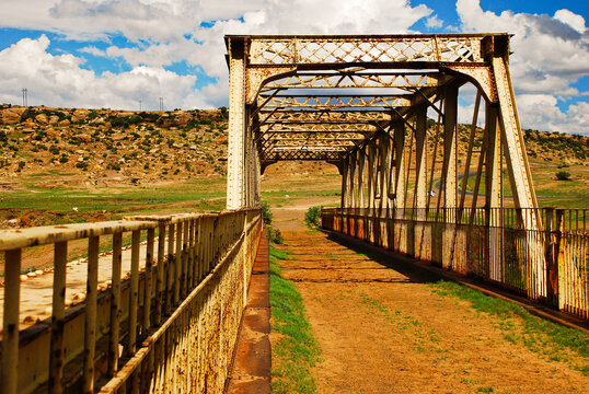 Old iron bridge over river in Lesotho countryside