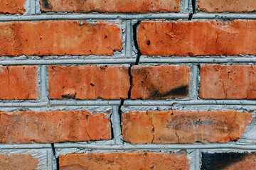 Fototapeta premium Large crack in the wall of brick