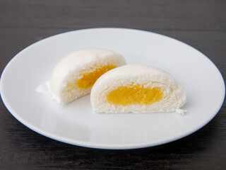 Salapao dim Sum China and thailand traditional street food, cut stuffed yellow custurd steamed bun...