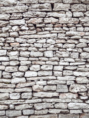 Texture of a antique stone wall. Old castle stone wall background