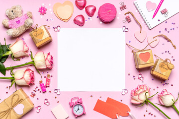Fototapeta na wymiar Happy Valentine's day. Roses flowers, hearts, gifts and decorative items in pink pastel colors on pink background. February 2021 month calendar. Valentine's day concept. Flat lay, top view