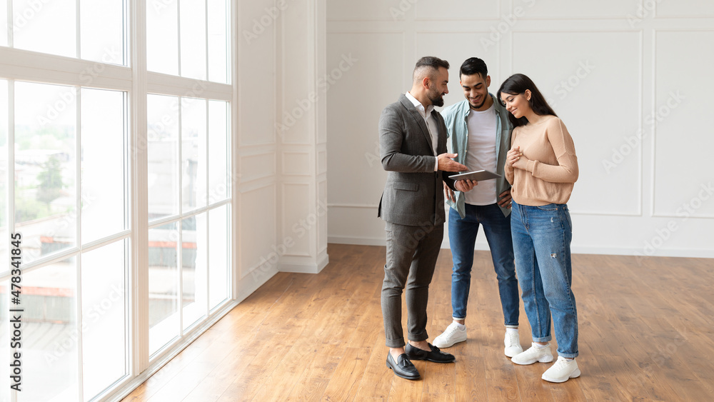 Sticker couple buying new apartment, house agent showing tablet