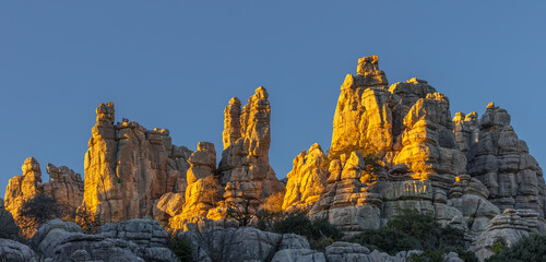 Sunset over the jagged limestone pillars and pinnacles of El Torcal de Antequera, Spain