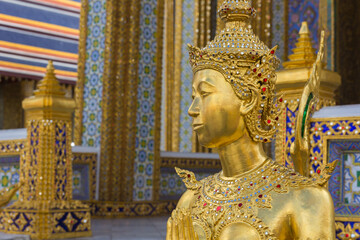 Golden Kinnari statue at Wat Phra Kaew, Bangkok, Thailand