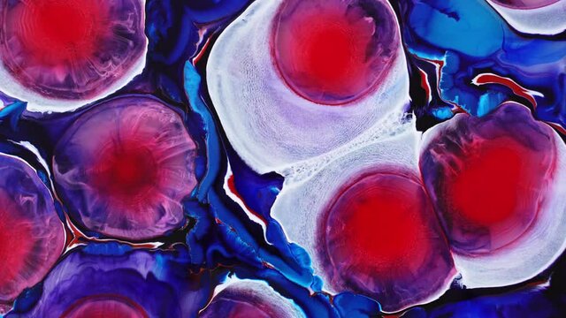 Background made with alcohol ink. Blooming magical red flowers. Ink in liquid. Circles of paint radiating over the surface. Deep ink spaces.