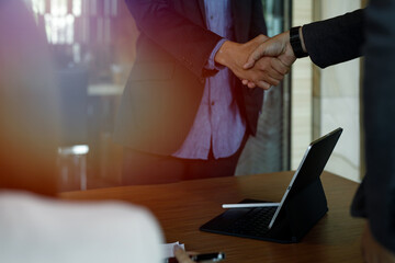 Businessmen making handshake in the office - business etiquette, congratulation, merger and acquisition concepts, panoramic banner