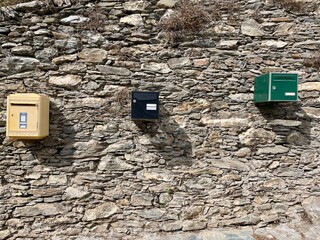 Monacia, d'Orezza, Corsica, 8.08.2021. Row of colorful letter boxes in Monacia-d'Orezza, a dreamy hilltop village nestled in the mountains of Castagniccia, Corsica, France.