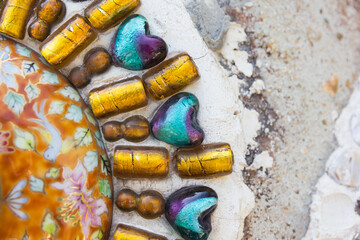Fototapeta na wymiar Beautiful texture of Colorful Mosaic at Wat Pha Sorn Kaew in Phetchabun province, Thailand