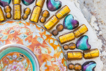 Fototapeta na wymiar Beautiful texture of Colorful Mosaic at Wat Pha Sorn Kaew in Phetchabun province, Thailand