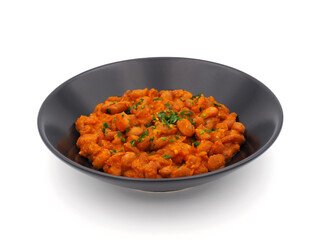 Cooked beans in tomato sauce isolated on white background