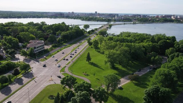 Flying over Olin Park and Looking Towards Downtown Madison in Summer (Drone - Tilting Right & Raising Altitude)