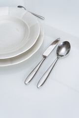 White table with silver cutlery