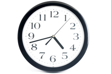 Black classic clock on isolated white background.