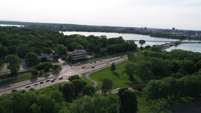 Flying over Olin Park and Looking Towards Downtown Madison in Summer (Drone - Tilting Right & Raising Altitude Slower)