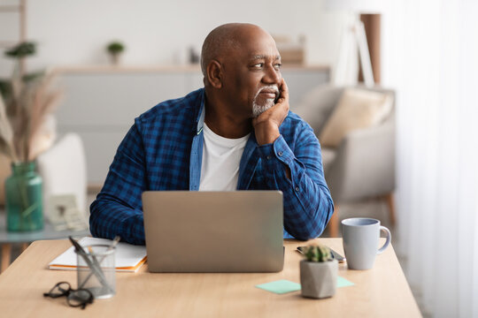 Senior African American Man At Laptop Sitting Working In Office