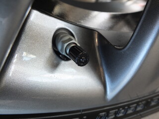 Aluminum wheel with  car tire nippel. The tire pressure sensor 