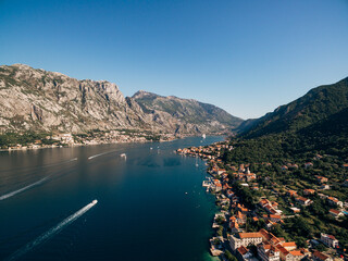 Aerial view of the ancient buildings of the town of Prcanj on the shore of the Kotor Bay