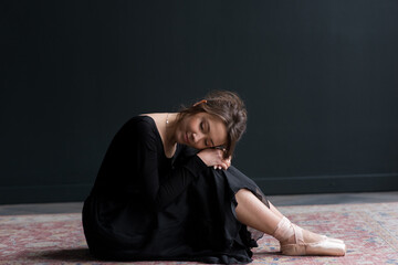 Ballet dancer on the black background