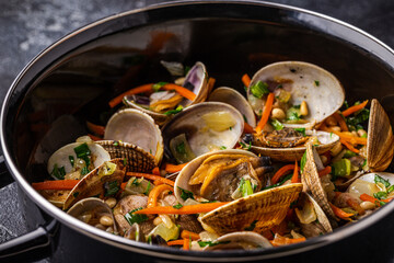 Shells vongole venus clams with vegetables and herbs